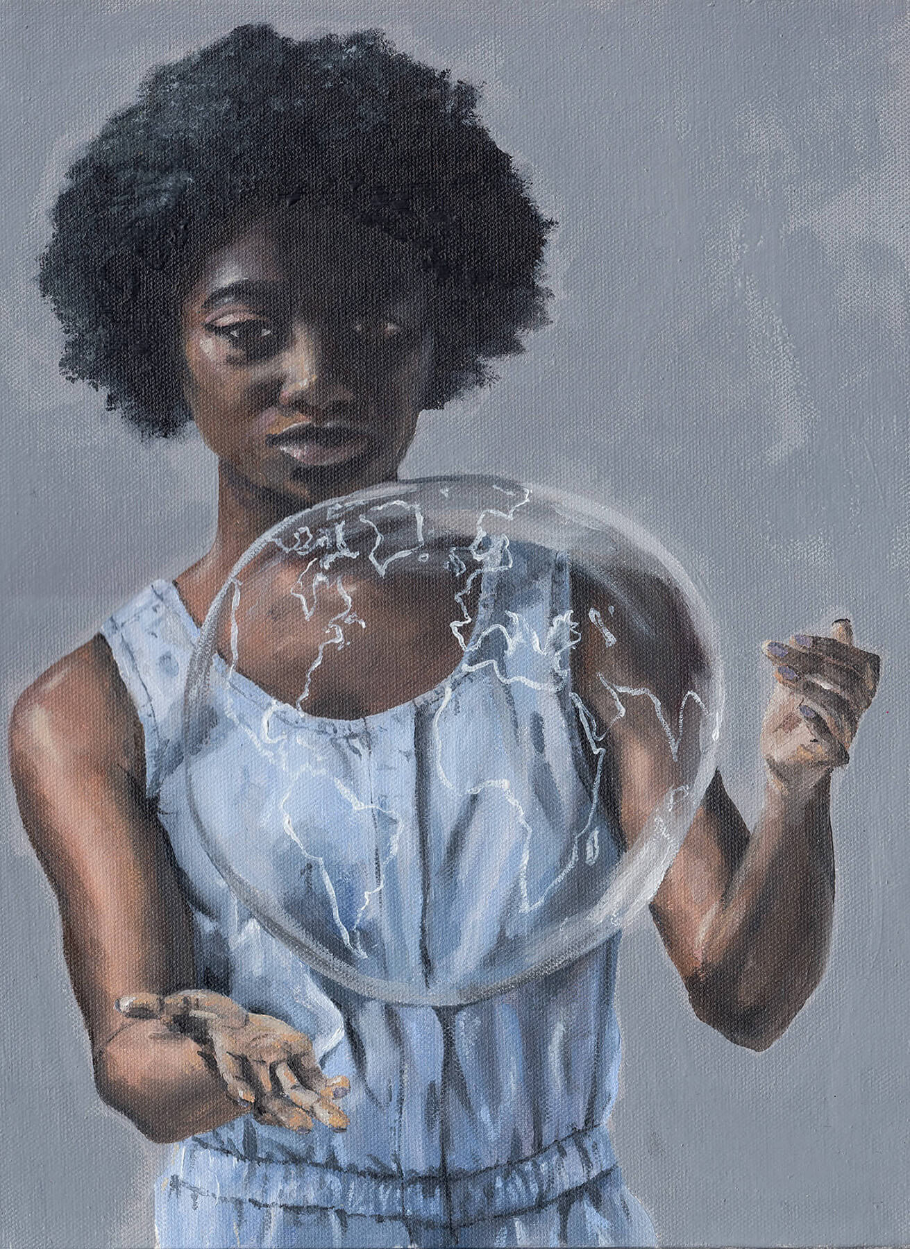 Person holding a glowing bubble against a gray background